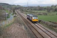 Pacer 142034, on the last westbound train of the day, clatters through north Lancashire at Keer Holme between Arkholme and Borwick on 4th April 2016. The five trains a day on the line are all worked from the Yorkshire side so timings of some are less than ideal with this last service leaving Leeds at 1645.<br><br>[Mark Bartlett 04/04/2016]