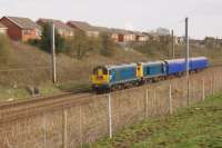 All that is missing is the double arrow logos on each loco and the photo could have been from 30 to 40 years ago. 20142 and 20189 pass Farington heading towards Preston whilst working the 5Z20 from Wolverton to Craigentinny with a pair of barrier coaches. The train actually only reached Carlisle later that night, completing the journey to Craigentinny the following day.<br><br>[John McIntyre 14/04/2016]