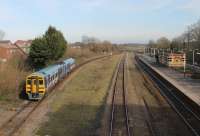 Northern 158901, originally a dedicated WYPTE unit, takes the sweeping curve of the Up Fast line through Kirkham station with a Blackpool to York service on 14th March 2016. The wide space between the tracks originally accommodated the station signal box and may have been intended for an additional but never built island platform. <br><br>[Mark Bartlett 14/03/2016]