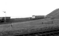 A DMU heading north from Parton, Cumbria, shortly after leaving the station in April 1972 with a Whitehaven – Carlisle service. The line in the foreground, which had latterly provided a rail link to Harrington Colliery, was closed completely the following year. [Ref query 2160] <br><br>[John Furnevel 22/04/1972]