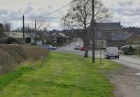 Looking west towards the level crossing over the ECML.  The grassy verge was the course of a 2'9' gauge tramway to Embleton Quarry, a mile and a half away, which entered Christon Bank goods yard just beyond the road junction, to the left. It operated from about 1895 to 1941.<br><br>[Bill Roberton 08/04/2016]