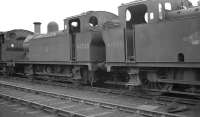 A siding containing withdrawn steam locomotives alongside Workington shed in September 1962. Fowler 3F 0-6-0s 47290 and 47593 are amongst the former residents awaiting disposal.<br><br>[K A Gray 22/09/1962]