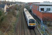 A Class 321 EMU slows for the stop at Hythe station on 7th January 2012. It will call after at Colchester Town, reverse and terminate at Colchester. Private housing, a large DIY store and student flats have replaced the industrial sites that used to feature in this view.<br><br>[Mark Dufton 07/01/2012]