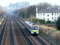 A ScotRail class 170 DMU in National Express livery catches the spring sunshine as it runs west through Saughton on 7 April 2003, shortly after leaving Haymarket on an Edinburgh - Glasgow shuttle service.<br><br>[John Furnevel 07/04/2003]