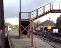 Passing the closed station of Aviemore Speyside on 30 October 2004, with Aviemore shed below the ex GNSR footbridge. The photograph was taken from the window of a train on the Strathspey Railway heading for Boat of Garten and Broomhill.<br><br>[John McIntyre 30/10/2004]