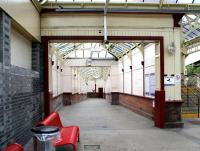 Exit from the Glasgow bound platform 1 at Port Glasgow station in April 2007. View is down the ramp towards Princes Street. The footbridge to the westbound platform is on the right. [See image 14815]<br><br>[John Furnevel 29/04/2007]