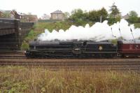 Ex LMS Black 5 no. 44871 is about to pass under Flag Lane bridge as it steams north towards Preston on day 3 of the Great Briton IX railtour.<br><br>[John McIntyre 28/04/2016]