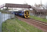 Makes a pleasant change from metal... the attractive wooden pedestrian footbridge that now spans the Borders Railway in Gore Glen Woodland Park. The northbound train is the 0845 (Sunday) Tweedbank - Edinburgh.<br><br>[John Furnevel 24/04/2016]