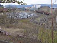 View over Leith South yard from the former CR Leith East branch, now a footpath.  Stacks of concrete sleepers, presumably for the Glasgow Queen Street rebuild, are evident.<br><br>[Bill Roberton 23/04/2016]