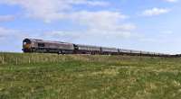 GB Railfreight 66746, in its new livery for operating the <I>Royal Scotsman</I> tours, leads the train away from Nairn on 19 April 2016,  with 66736 <I>Wolverhampton Wanderers</I> bringing up the rear.<br><br>[John Gray 19/04/2016]