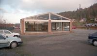 In 2000 this showroom stood on the site of the original Peebles terminus. The view looks north. This site is now occupied by flats. The March Street Mills are off to the left and to the right was the extension of the line east to Galashiels via the 'new' Peebles station.<br><br>
<br><br>
This station became known as 'Peebles Old' after closure to passengers, being retained for goods,  a sawmill and later the March Street Mills.<br><br>[Ewan Crawford //2000]