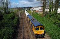 Fort William to North Blyth empties running past Cardross station hauled by 66740. Shot taken completely blind over high parapet with a surprisingly good result.<br><br>[Ewan Crawford 22/04/2016]