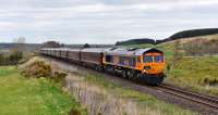 With paintwork gleaming,66736 'Wolverhampton Wanderers' makes the short trip from Inverness to Carrbridge with The Royal Scotsman.Pictured passing Castletown near Inverness.<br><br>[John Gray 20/04/2016]