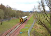 ScotRail 158735 has just passed the Scottish Mining Museum on the site of the former Lady Victoria Colliery with a Sunday morning service to Tweedbank. View is south from the B704 road bridge on 24 April 2016. The road here originally spanned both the Waverley route and several colliery lines, with the area on the left once housing a yard and loading plant [see image 6115]. <br><br>[John Furnevel 24/04/2016]