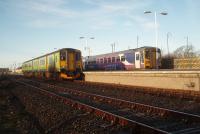 Newly cascaded from the West Midlands to Northern, Sprinter 150206 stands alongside 153352 at Morecambe in January 2012. Purple vinyl was quickly applied to the new arrivals and the green Centro livery wasn't seen around the North West for long.<br><br>[Mark Bartlett 13/01/2012]