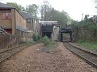 Standing on the former location of the island platform at Newington Station looking east to OB 17 Craigmillar Park/Mayfield Gardens. Now the only form of public transport here is a Lothian Buses service seen on the bridge. Both lines are jointed rail. Buddleia is growing happily in the ballast. For a view from the opposite side of the bridge [see image 54140].<br><br>[Charlie Niven 25/04/2002]