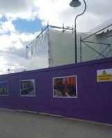 Hoardings protect ongoing work on the badly fire damaged Ballater station building <br><br>[John Yellowlees 30/04/2016]