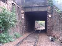 Detailed close up of Up line passing under OB 17 Craigmillar Park/Mayfield Gardens and adjacent steps down onto the platform at the former Newington Station.<br><br>[Charlie Niven 25/04/2002]