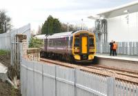 Looking south east towards the platform at Alloa from Old Brewery Lane on 24 April 2008, with ScotRail 158730 standing at the buffer stops. The unit is waiting to return to Stirling on a crew familiarisation trip, with less than four weeks to go before recommencement of public services over the route.<br><br>[John Furnevel 24/04/2008]