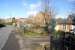 The former station building at Desborough and Rothwell viewed from the public road on 4 March 2016. A passing EMT Meridian unit can be seen to the left of the building.<br><br>[John McIntyre 04/03/2016]