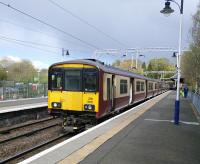 SPT carmine and cream lingers on. The driver prepares 318 250 heading a Cumbernauld service on 30/04/2016. With Platform 2 being used for stabling turnaround times are not long, with the driver having just enough time to walk six coaches.<br><br>[David Panton 30/04/2016]