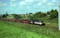 A Virgin HST (although the leading power car is still in Inter City livery) heads south from Preston passing the Farington area in September 1999.<br><br>[John McIntyre /09/1999]