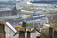 Looking over the rooftops of Stirling on 15 April 2008, with a ScotRail 158 approaching the station from the south. The 2-car train is just passing Stirling Middle signal box.<br><br>[John Furnevel 15/04/2008]