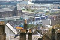 Looking over the rooftops of Stirling on 15 April 2008, with a ScotRail 158 approaching the station from the south. The 2-car train is just passing Stirling Middle signal box.<br><br>[John Furnevel 15/04/2008]