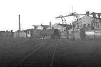 Sunshine and shadows at Ayr shed. Locomotives and rolling stock standing on the condemned line along the north side of the shed yard on 23 October 1965, including home based <I>Crab</I> 2-6-0 no 42789. The locomotive was not 'officially' withdrawn until late in 1966 following a brief 'reallocation' to Motherwell. This was followed by the short trip to MMS Wishaw, where it was eventually cut up in April 1967.   <br><br>[K A Gray 23/10/1965]