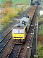 The returning Dalzell - Lackenby steel flats approaching Millerhill yard on 8 July 1997 on their way south. Locomotive is 60031 in BR Railfreight Distribution (Metals Sector) livery. <br><br>[John Furnevel 08/07/1997]