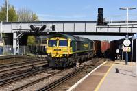 Freightliner 66594 with a train of containers heading south on the centre road through Eastleigh station on 6 May 2016, bound for Southampton docks.<br><br>[Peter Todd 05/05/2016]