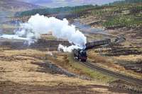 Black 5 No.44871 leads The Great Britain IX through the Strath of Kildonan and begins to accelerate away from the bridge over the River Helmsdale up the gradient to Kinbrace. Class 47 No.47760 is giving a wee shove at the rear.<br><br>[John Gray 01/05/2016]