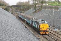 Seen from Hampson Lane bridge on 4th April 2016, DRS 37423 propels the 0515 Carlisle to Preston through the newly finished cutting just south of Galgate. The Cumbrian Coast push-pull sets have been playing a supporting role to Paul Merton in the recent television series <I>Secret Stations</I>.<br><br>[Mark Bartlett 04/04/2016]