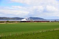 Black 5 No.44871,on the way to Kyle of Lochalsh,runs alongside the Beauly Firth near the site of the closed station at Clunes.The Kessock Bridge in the background.<br><br>[John Gray 02/05/2016]