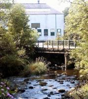 <h4><a href='/locations/K/Kinleith_Mill'>Kinleith Mill</a></h4><p><small><a href='/companies/B/Balerno_Branch_Caledonian_Railway'>Balerno Branch (Caledonian Railway)</a></small></p><p>Some of the surviving buildings that once formed part of the rail served Kinleith paper mill (closed 1966) standing alongside the Water of Leith near Currie on the Balerno branch in September 2002. The location had by this time become known as 'Kinleith Industrial Estate'. See image <a href='/img/55/24/index.html'>55024</a> 42/81</p><p>22/09/2002<br><small><a href='/contributors/John_Furnevel'>John Furnevel</a></small></p>