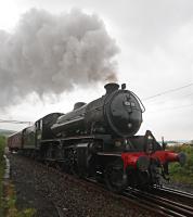 62005 restarts and takes to the West Highland Line at Craigendoran Junction after a pause. The locomotive is on its way to Fort William for the Jacobite season.<br><br>[Ewan Crawford 17/05/2016]