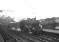 Kingmoor Black 5 no 45148 standing at the north end of Carlisle platform 3 on a cold and damp February day in 1964 at the head of the 9.25am Crewe - Perth.<br><br>[K A Gray 22/02/1964]