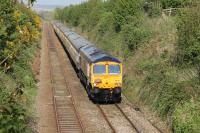 GBRf 66737 <I>Lesia</I> hauls the return leg of Pathfinder's <I>Yorkshire Dales Explorer</I> Salisbury to Leeds excursion on 14th May 2016. The train is retracing its outward journey over the <I>Little North Western</I> route and approaching the closed station at Borwick. <br><br>[Mark Bartlett 14/05/2016]