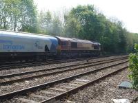 DB Cargo operated EWS liveried 66096 proceeds across Hillam Gates level crossing on 12 May with a loaded biomass working from Hull or Immingham to Drax Power station, utilising Drax Power owned wagons. <br><br>[David Pesterfield 12/05/2016]