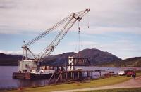 In this summer of 1998 view the remains of the disassembled deck of Creagan bridge are being cut on the shoreline at Barcaldine, prior to transportation to Glasgow by a scrap dealer. The barge was the 'Mersey Mammoth' and could only work during calm weather for obvious reasons!  <br><br>[Clive Meredith //1998]