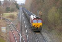 EWS 66235 passing Maxwelltown Goods Junction on the northern approach to Dumfries in April 2006 with a coal train from Killoch bound for Drax power station.<br><br>[John Furnevel 17/04/2006]