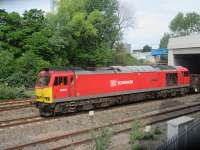 60039 emerging from the new over bridge constructed for the Port Talbot relief road with empties returning to Margam Knuckle Yard from Trostre.<br><br>[Alastair McLellan 19/05/2016]