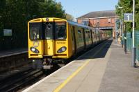 A Liverpool bound Merseyrail service prepares to depart from Hillside on the Northern line on 19 May 2013.<br><br>[John McIntyre 19/05/2013]