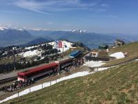 As a service from Vitznau disgorges its passengers a service from Arth Goldau arrives at Rigi Kulm on the Rigi mountain on a perfect day weatherwise for a trip on this Swiss mountain railway.<br><br>[Michael Gibb 08/05/2016]