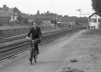 'The Nairn Biker'. The signalman cycles from the West 'box to the East to set the road for an approaching train, the token equipment being located in the station building.  This practice ceased in 2000.<br><br>[Bill Roberton //1992]