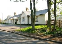 Sunshine on Stanhope. Road approach to the refurbished station at Stanhope in May 2006, now part of the Weardale Railway. [See image 21987]<br><br>[John Furnevel 08/05/2006]