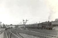 A 'Women's Guild Special' for Penrith awaiting its departure time at Largs on 24 May 1960. The locomotive is Jubilee 45697 <I>Achilles</I>.<br><br>[G H Robin collection by courtesy of the Mitchell Library, Glasgow 24/05/1960]