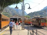 A train on the left awaits departure time from Soller while a tram forms up outside the depot.<br><br>[Mark Wringe 27/07/2014]