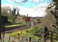 This photograph almost defines the country railway. A class 150 approaches the farmers' crossing North of Freshford station on a beautiful spring Saturday in 2016. [Ref query 6631]<br><br>[Ken Strachan 30/04/2016]