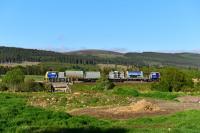 Caught out of position, I only just managed this shot of the weed-killing train as it was allowed to leave Inverness twenty minutes early. It consists of two MPV's coupled back to back, No's 98911 and 98961.<br><br>[John Gray 03/06/2016]